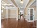 Elegant dining room featuring hardwood floors, decorative tray ceiling, and neutral paint colors at 224 Alexandria Dr, Mooresville, NC 28115