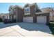 Spacious three-car garage of a brick home, offering ample parking and storage space at 224 Alexandria Dr, Mooresville, NC 28115