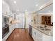 Modern kitchen with stainless steel appliances, granite countertops, and ample cabinet space at 224 Alexandria Dr, Mooresville, NC 28115