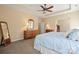 Spacious primary bedroom featuring neutral walls, plush carpet, and arched entry at 224 Alexandria Dr, Mooresville, NC 28115