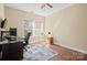 Bright home office with hardwood floors and a large window, ideal for working from home at 224 Alexandria Dr, Mooresville, NC 28115