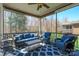 Cozy screened patio with comfortable seating and overhead fan at 224 Alexandria Dr, Mooresville, NC 28115