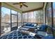 Screened patio with comfortable seating and a view of the back yard at 224 Alexandria Dr, Mooresville, NC 28115