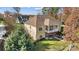 Aerial view of home with large backyard, covered porch, and lake access at 226 Hermance Ln, Mooresville, NC 28117