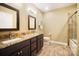 Bright bathroom with double sink vanity, granite countertop, and shower with glass door at 226 Hermance Ln, Mooresville, NC 28117