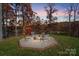Outdoor fire pit area with chairs, offering a cozy spot for gathering and enjoying the natural surroundings at 226 Hermance Ln, Mooresville, NC 28117