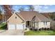 Charming home with a well-manicured lawn, two car garage and beautiful stone and siding exterior at 226 Hermance Ln, Mooresville, NC 28117