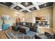 Open-concept living room with coffered ceiling, adjacent to the kitchen and dining areas, with great natural light at 226 Hermance Ln, Mooresville, NC 28117