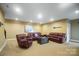 Comfortable living room with leather seating and neutral décor ideal for relaxing and entertaining at 226 Hermance Ln, Mooresville, NC 28117