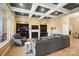 Inviting living room with coffered ceilings, a cozy fireplace, built-in bookcases, and plush seating at 226 Hermance Ln, Mooresville, NC 28117