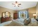 Spacious main bedroom features a ceiling fan, closet, and large windows with beautiful outdoor views at 226 Hermance Ln, Mooresville, NC 28117