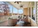 Relaxing screened porch with comfortable seating and scenic views of the lake and surrounding trees at 226 Hermance Ln, Mooresville, NC 28117