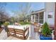 Relaxing backyard featuring outdoor furniture, a screened porch, and a blossoming tree at 230 Pond View Ln, Fort Mill, SC 29715