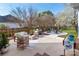Expansive backyard with a patio featuring wicker furniture, grill and firepit seating area for outdoor living at 230 Pond View Ln, Fort Mill, SC 29715