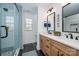 Beautiful bathroom featuring double vanities, tile flooring, and modern walk-in shower with glass door at 230 Pond View Ln, Fort Mill, SC 29715