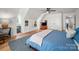 Bedroom with hardwood floors, a bed, an angled ceiling and white walls with art and two closets at 230 Pond View Ln, Fort Mill, SC 29715
