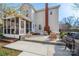 Exterior of the home shows the backyard and patio, screened porch, and outdoor fireplace feature at 230 Pond View Ln, Fort Mill, SC 29715