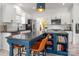 Renovated kitchen features stainless appliances, white cabinets, a prep sink, and seating at the island at 230 Pond View Ln, Fort Mill, SC 29715