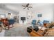 Open-concept living room flowing into kitchen, with light-colored wood floors and neutral walls at 230 Pond View Ln, Fort Mill, SC 29715
