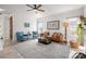 Light and airy living room with wood floors, fireplace, comfortable seating, and fan at 230 Pond View Ln, Fort Mill, SC 29715