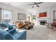 Bright living room with cozy seating, fireplace, and gorgeous natural light at 230 Pond View Ln, Fort Mill, SC 29715