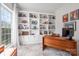 Home office with large built-in shelving, a wooden desk, and tons of natural light at 230 Pond View Ln, Fort Mill, SC 29715