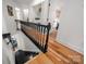 View down staircase to the living room and upstairs to the bedroom at 230 Pond View Ln, Fort Mill, SC 29715