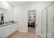 Bright bathroom with double vanity, granite counters, and a glass-enclosed shower, leading to a bedroom at 3222 Maple Ridge Dr, Gastonia, NC 28052