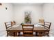 Inviting dining room with wooden table, chairs, and natural light from the window at 3222 Maple Ridge Dr, Gastonia, NC 28052