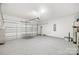 Spacious two-car garage with epoxy flooring, overhead door, and ample space for storage and projects at 3222 Maple Ridge Dr, Gastonia, NC 28052