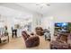 Open-concept living room with views of the kitchen, modern furnishings, and laminate floors at 3222 Maple Ridge Dr, Gastonia, NC 28052