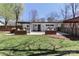 Wide view of a backyard with a custom outdoor bar, wood planters and an entertaining area at 324 East End S Ave, Statesville, NC 28677