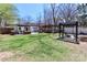 Expansive backyard showcasing a firepit under a pergola, offering a relaxing outdoor retreat at 324 East End S Ave, Statesville, NC 28677