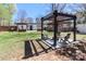 Spacious backyard featuring a modern pergola and patio area, perfect for outdoor entertaining at 324 East End S Ave, Statesville, NC 28677