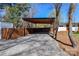 Large carport provides covered parking and complements the home's contemporary design at 324 East End S Ave, Statesville, NC 28677