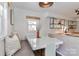 Bright dining area with built-in bench seating, a modern table, and designer lighting at 324 East End S Ave, Statesville, NC 28677