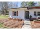 Attractive home with a welcoming porch and manicured landscaping, enhancing its overall appeal at 324 East End S Ave, Statesville, NC 28677