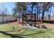 Outdoor pergola featuring a fire pit surrounded by mature trees; enjoy outdoor living at 324 East End S Ave, Statesville, NC 28677