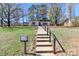 Charming home with a welcoming walkway leading to the entrance, surrounded by lush greenery at 324 East End S Ave, Statesville, NC 28677