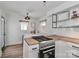 Stylish kitchen featuring stainless steel appliances, butcher block countertops, and a dining nook at 324 East End S Ave, Statesville, NC 28677