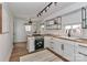 Modern kitchen featuring butcher block countertops, white cabinets, and stainless steel appliances at 324 East End S Ave, Statesville, NC 28677