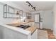 Well-appointed kitchen with updated appliances, butcher block countertops, and modern lighting at 324 East End S Ave, Statesville, NC 28677