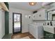 Bright laundry room with modern washer, dryer and utility sink at 324 East End S Ave, Statesville, NC 28677