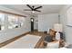 Comfortable living room with ample natural light, ceiling fan, and hardwood flooring at 324 East End S Ave, Statesville, NC 28677