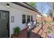 Welcoming covered porch with comfortable seating and garden boxes, creating a cozy outdoor space at 324 East End S Ave, Statesville, NC 28677