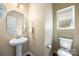 Half bathroom featuring a pedestal sink, modern fixtures, and natural light at 352 Nantucket Way, Rock Hill, SC 29732
