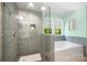 Modern bathroom with a glass shower, soaking tub, and beautiful tile work at 352 Nantucket Way, Rock Hill, SC 29732