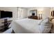 Bright bedroom featuring neutral walls, a comfortable bed, dresser and mounted TV at 352 Nantucket Way, Rock Hill, SC 29732