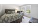 Cozy bedroom with a patterned bedspread, desk, and natural light from the windows at 352 Nantucket Way, Rock Hill, SC 29732