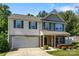 Charming two-story home with a well-manicured lawn and attached garage provides a welcoming and functional living space at 352 Nantucket Way, Rock Hill, SC 29732